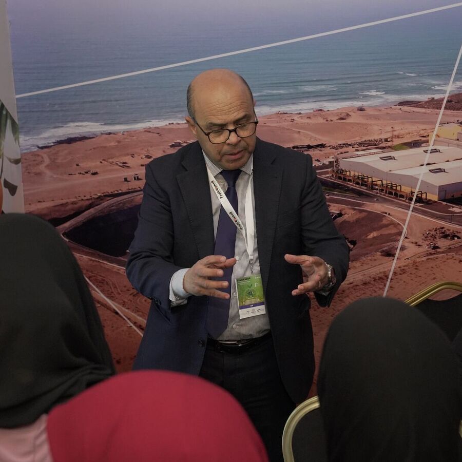 Speaker presenting a desalination project at a Fruit Council 2025 stand